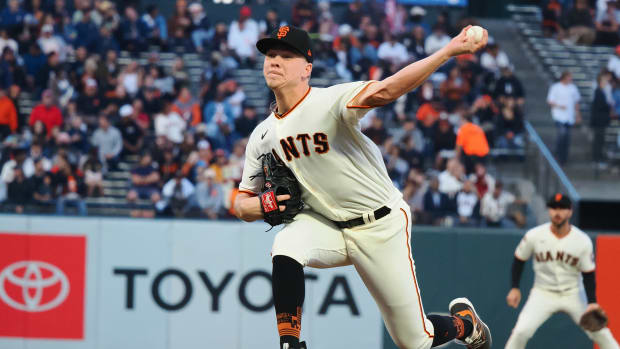SF Giants starting pitcher Kyle Harrison throws a pitch against the Cincinnati Reds during the third inning at Oracle Park on August 28, 2023.